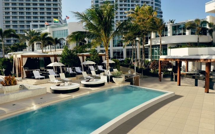 Poolscape with day beds & cabanas at Arkadia Day Club