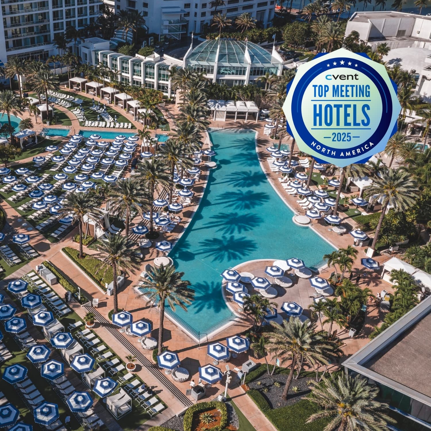 Architectural Image of pools at Fontainebleau Miami Beach with a Cvent Top Meeting Hotels badge 2025